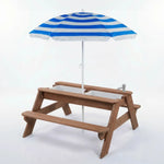 Wooden picnic table with a blue and white striped umbrella on a white background